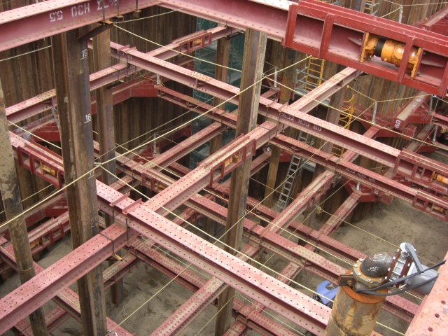 The axial strain of beams at this work site are measured by those strings hanging from the braces. The knowledge collected is useful in order to record interstory drift ratios.